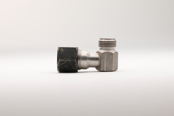 A single 90 degree nps tube adapter